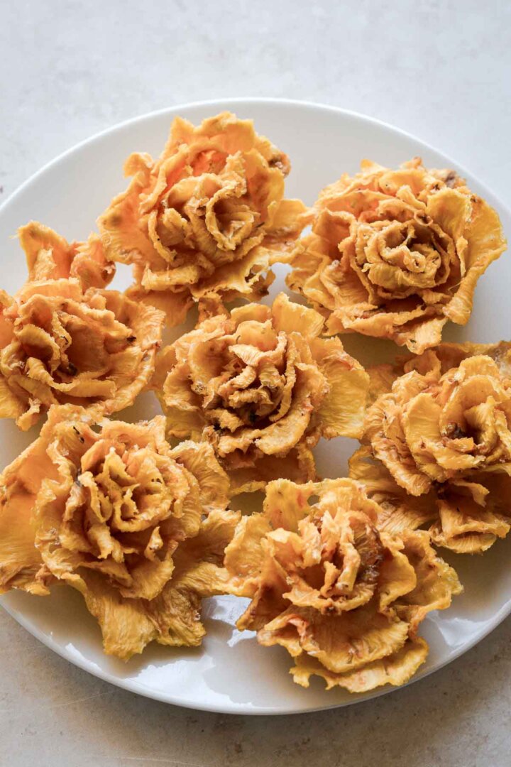 Edible flowers made from dried pineapple slices.