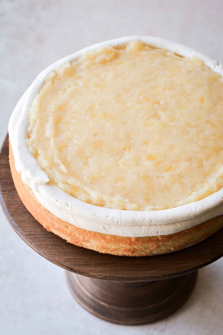 Step 1 for assembling a pineapple coconut cake.