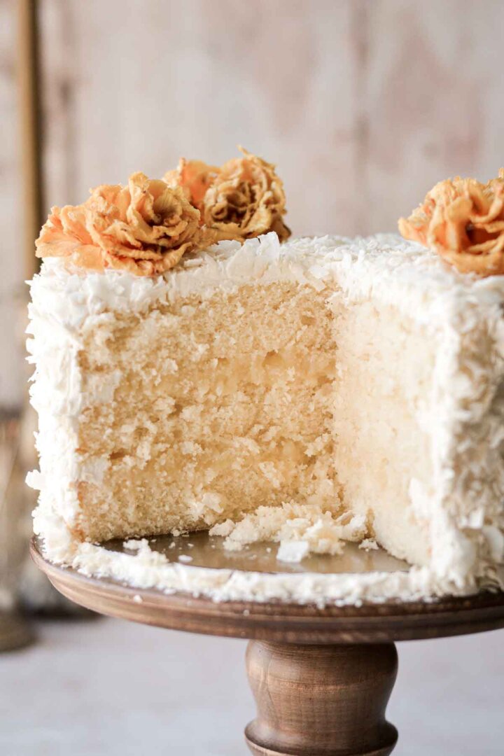 Pineapple coconut cake, cut to show the layers inside.