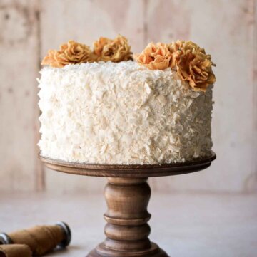 Pineapple coconut cake, decorated with dried edible pineapple flowers.