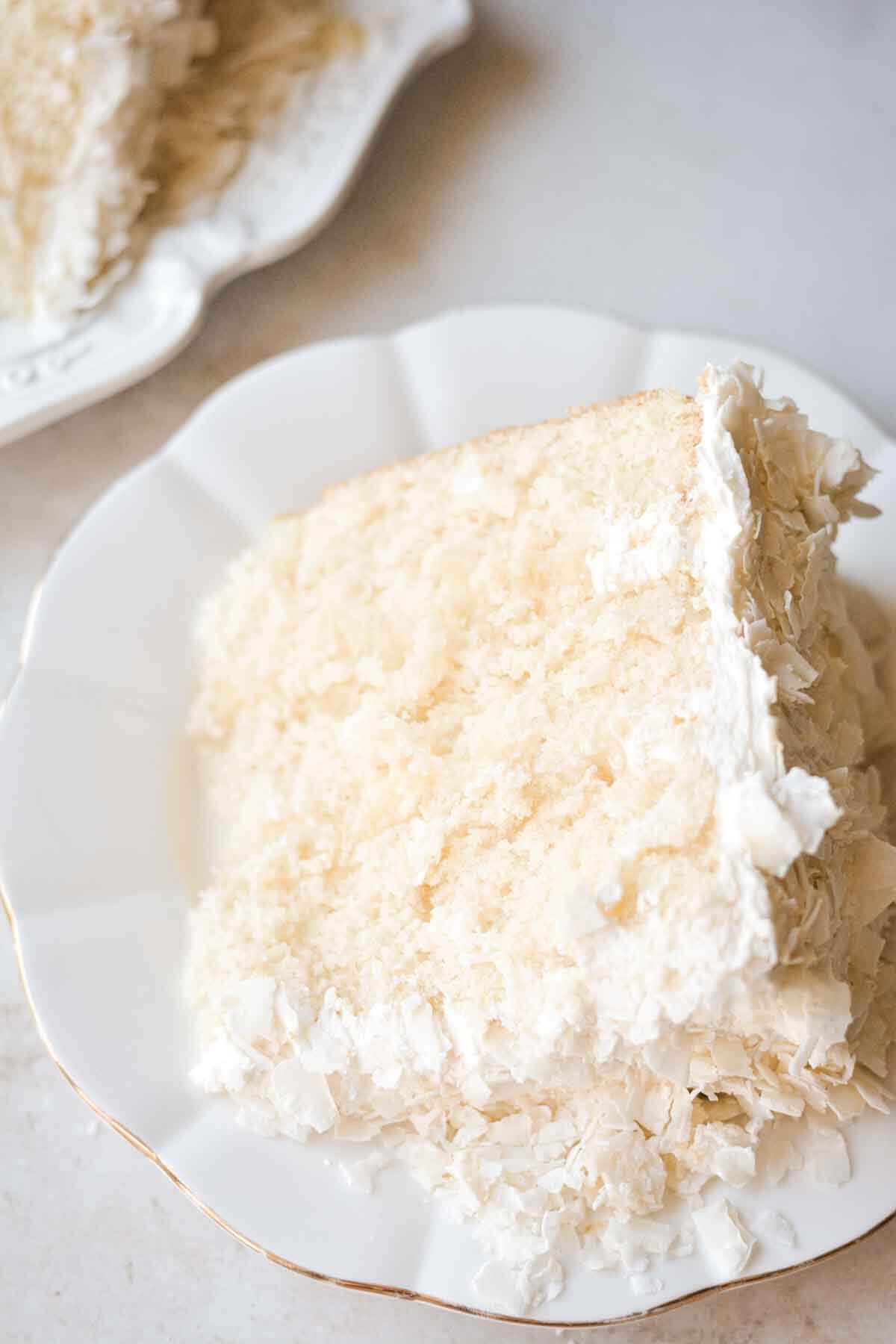Slice of pineapple coconut cake on a plate.