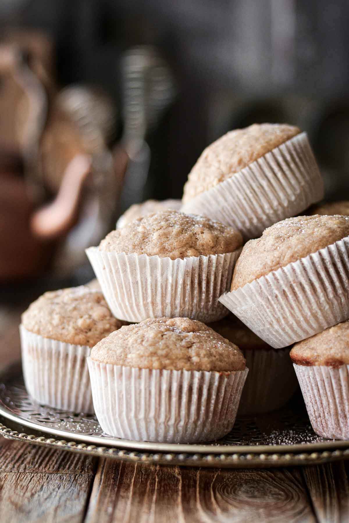 Banana muffins stacked on a plate.