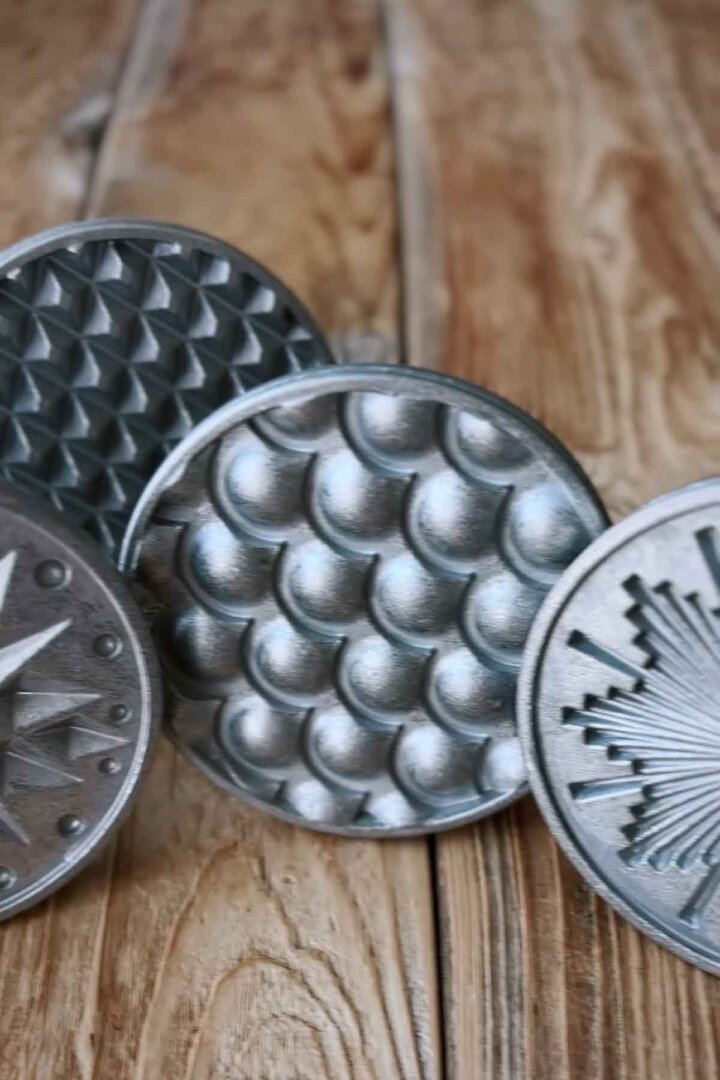 Assorted cast iron cookie stamps.
