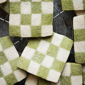 Green and white checkerboard cookies, sprinkled with sugar.