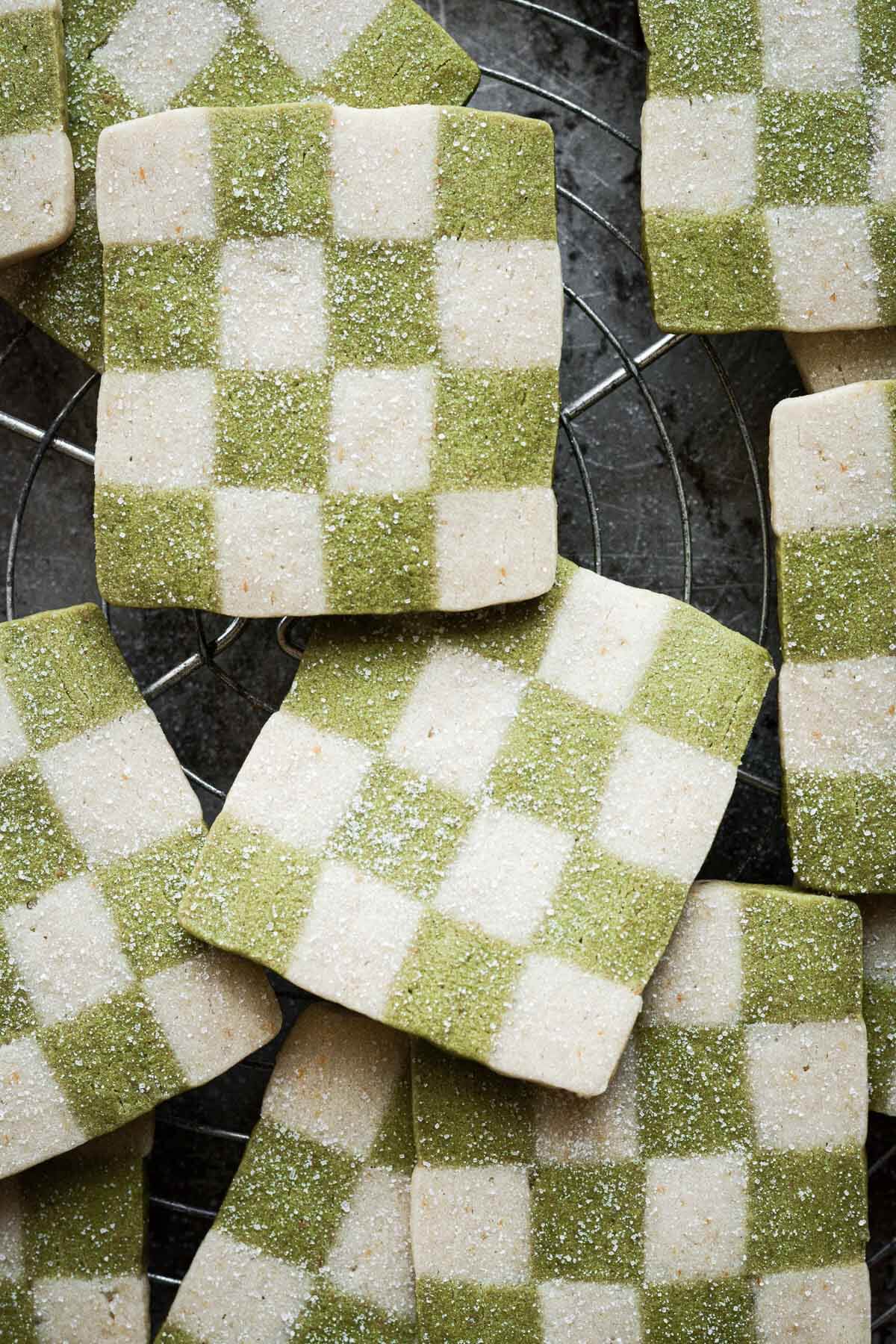 Green and white checkerboard cookies, sprinkled with sugar.