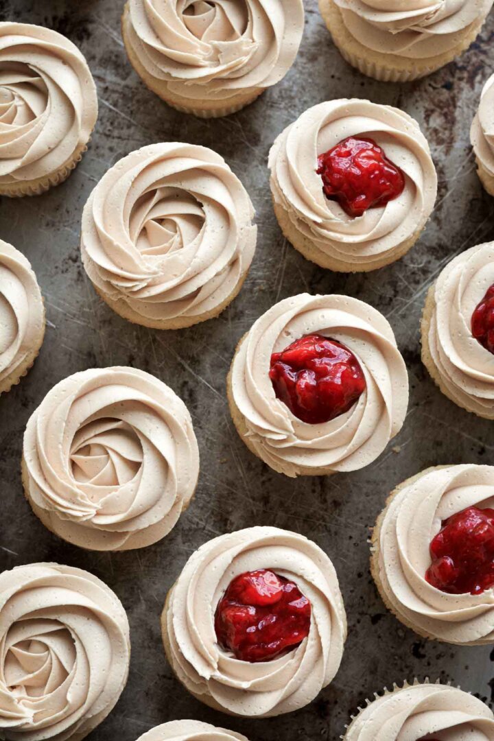 Vanilla cupcakes, with peanut butter frosting, and topped with strawberry compote.
