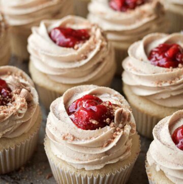 Peanut butter and jelly cupcakes, topped with strawberry compote and crushed peanuts.
