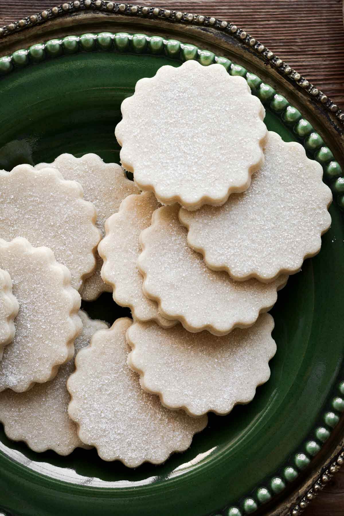 Shortbread cookies on a green plate.