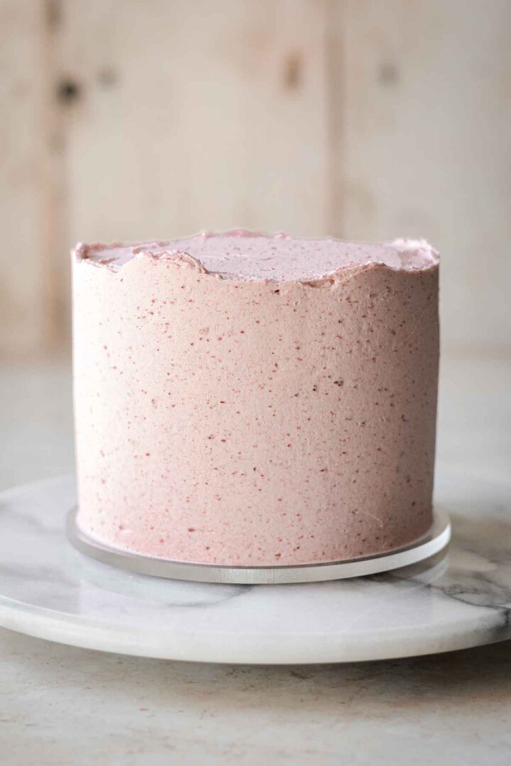 Matcha cake frosted with strawberry buttercream.