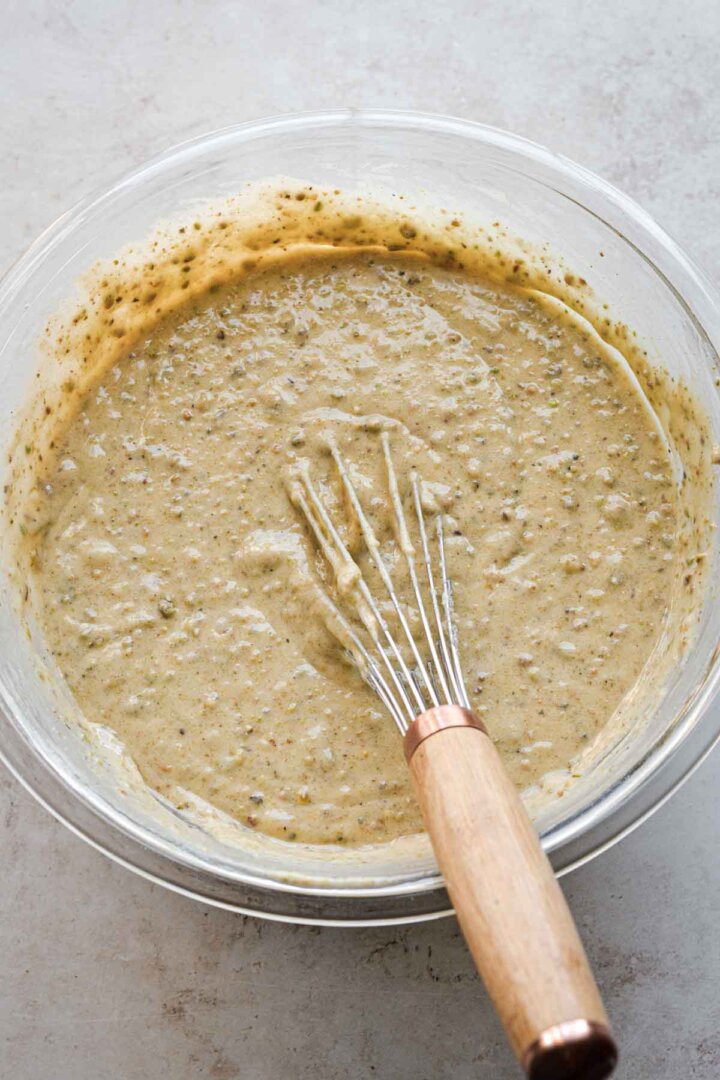 Step 2 for making strawberry pistachio cupcakes - whisking the batter.