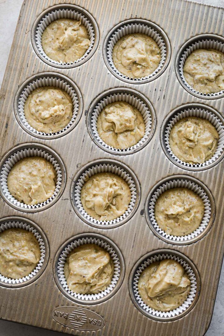 Step 3 for making strawberry pistachio cupcakes - batter in a cupcake pan.