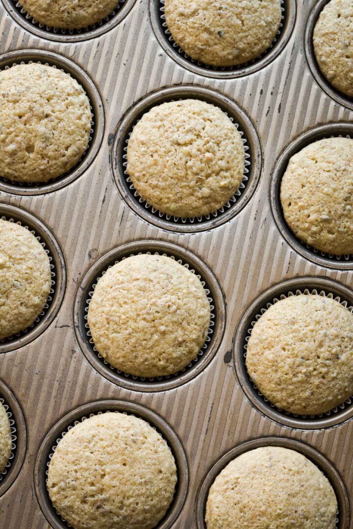 Pistachio cupcakes in a cupcake pan.