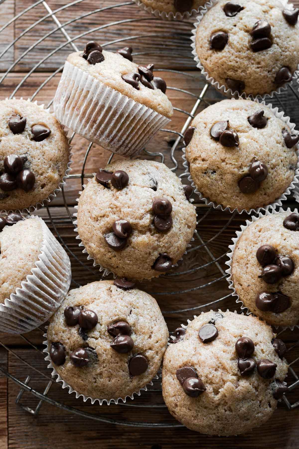 Banana chocolate chip muffins on a cooling rack.