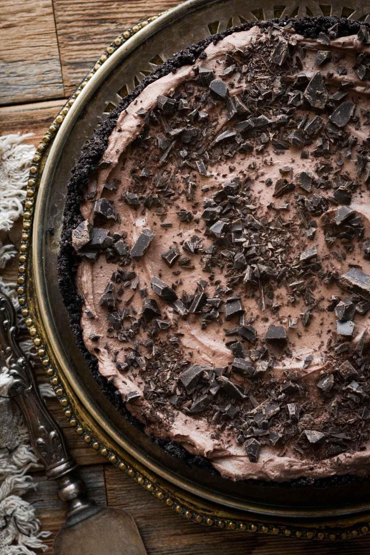 Chocolate cheesecake sprinkled with chopped chocolate.