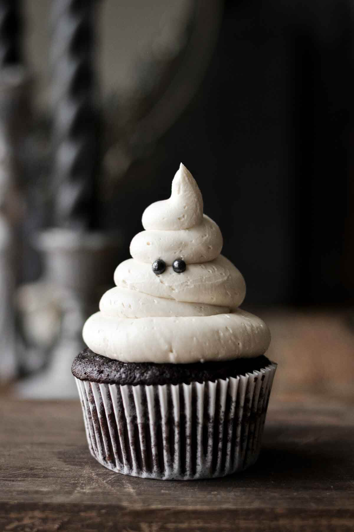 Ghost cupcake with sugar pearl eyes.