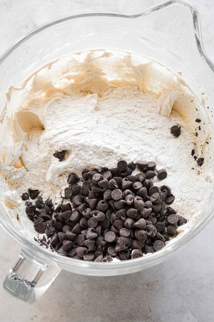 Step 4 for making bakery chocolate ship cookies - adding dry ingredients and chocolate chips.