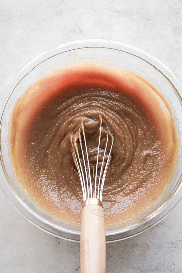 Step 3 for making peanut butter cookies - whisking the dough.