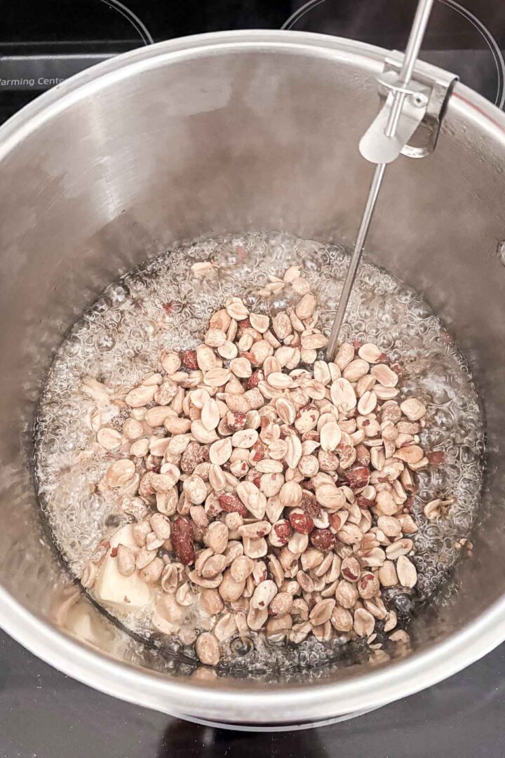 Step 3 for making peanut brittle - adding peanuts.
