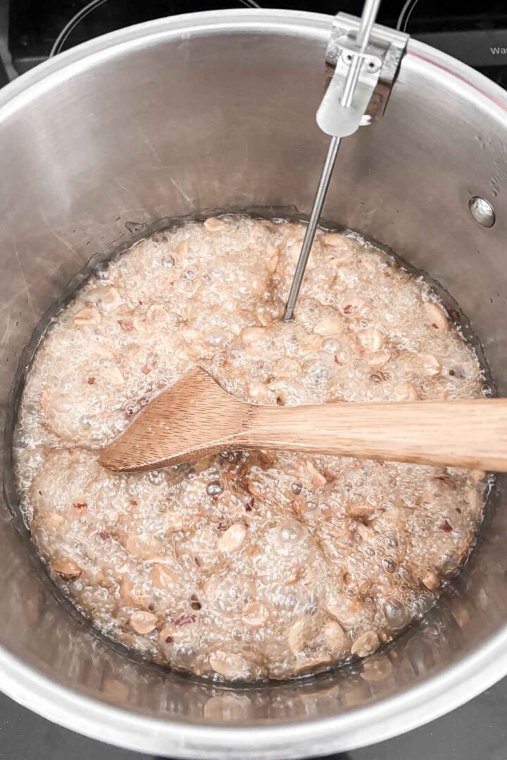 Step 4 for making peanut brittle - stirring the candy.