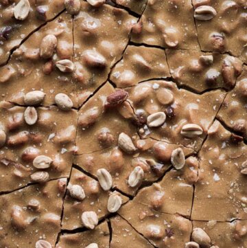 Peanut brittle, broken into jagged chunks.