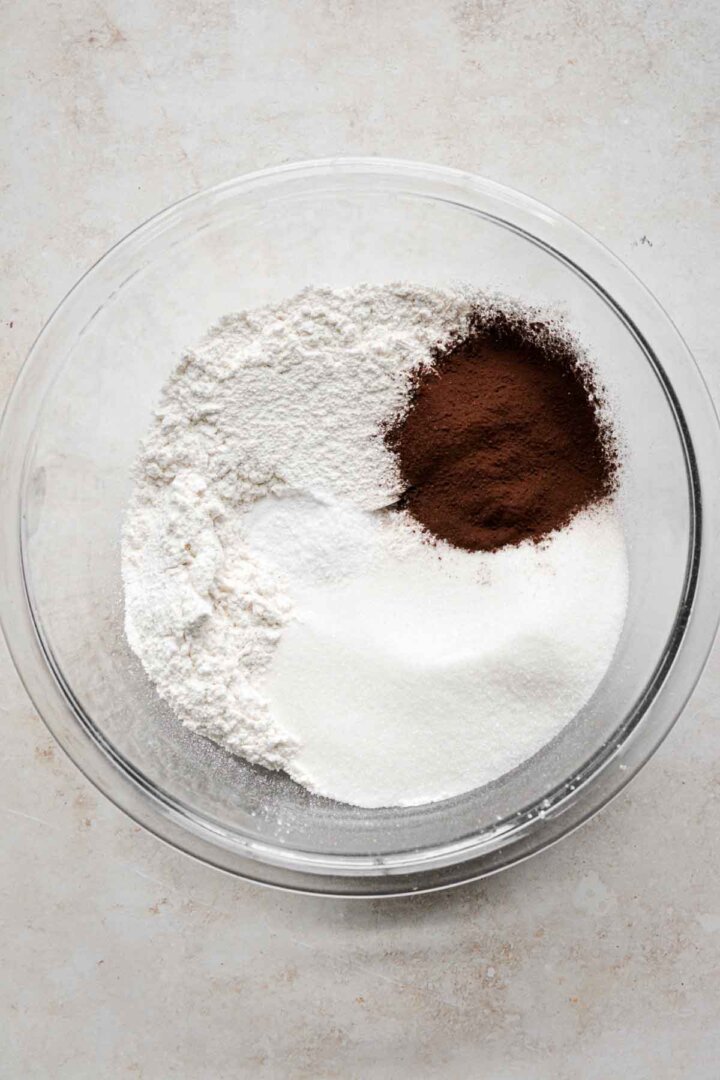 Step 1 for making red velvet chocolate chip cake - mixing dry ingredients.