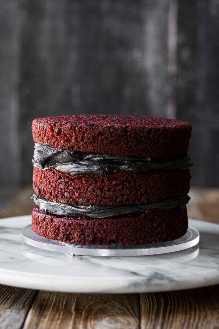 Red velvet cakes, layered with black cocoa buttercream.