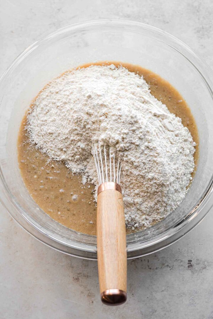 Step 4 for making cashew cake - whisking in ingredients.