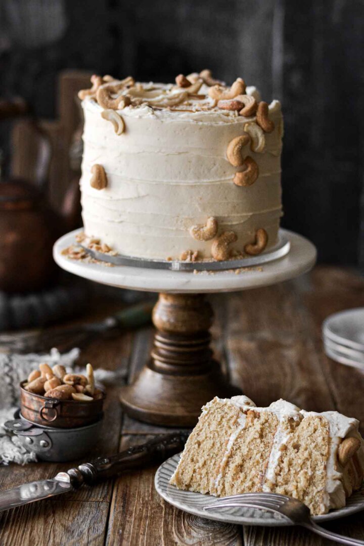 Cashew caramel cake with a slice cut.